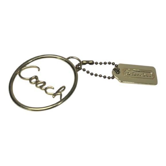 Coach Accessories - Coach Gold charm with Gold Hang Tag! Comes with Dusty!